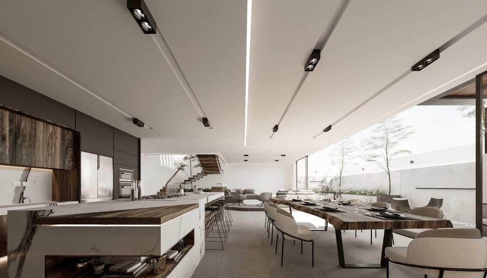 Exemple d'une grande salle à manger ouverte sur la cuisine moderne avec un mur blanc, un sol en carrelage de porcelaine, un sol blanc et un plafond voûté.