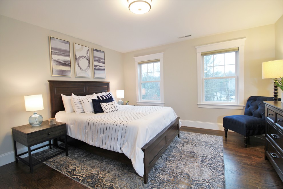 Inspiration for a large transitional guest dark wood floor and brown floor bedroom remodel in Boston with beige walls
