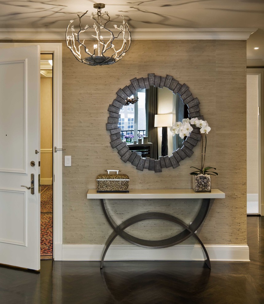 Inspiration for a transitional entryway in New York with beige walls and dark hardwood floors.