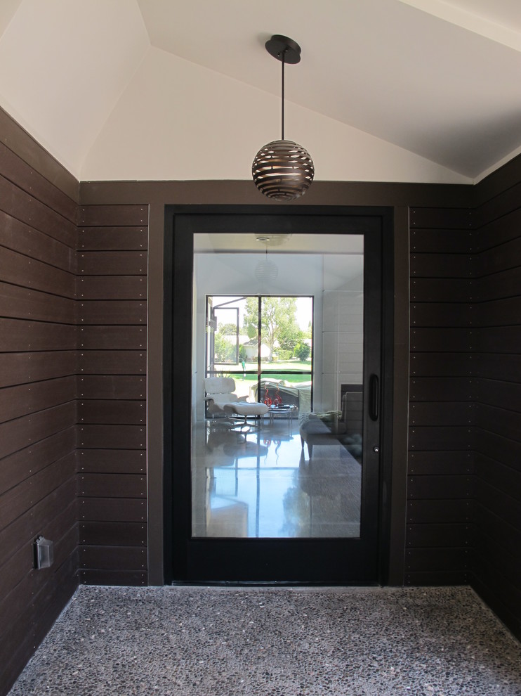 This is an example of a midcentury entryway in Orange County.
