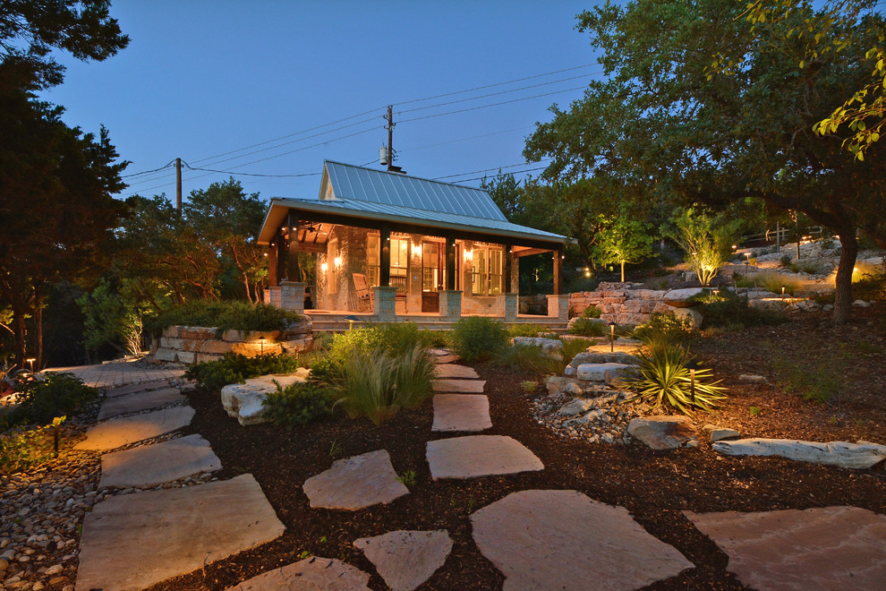 Inspiration for a country sloped garden in Austin.