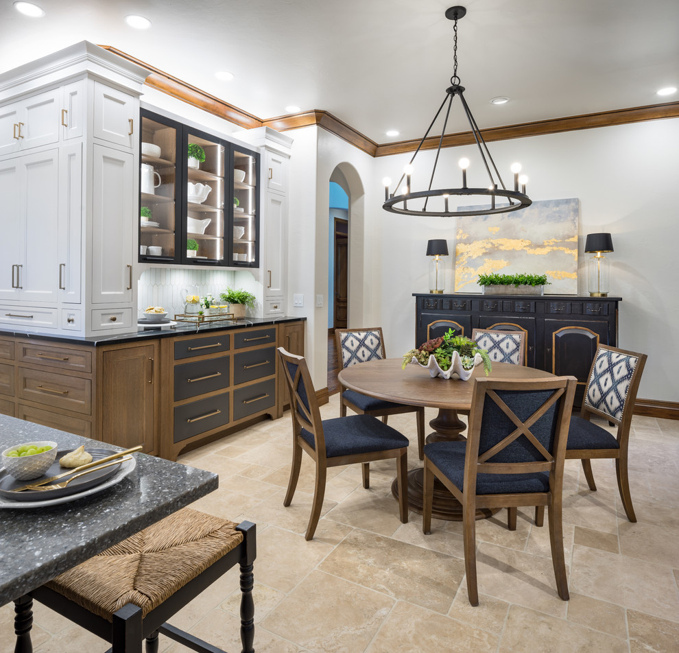 Design ideas for a large country l-shaped separate kitchen in Oklahoma City with an undermount sink, white cabinets, quartz benchtops, white splashback, porcelain splashback, panelled appliances, marble floors, with island and black benchtop.