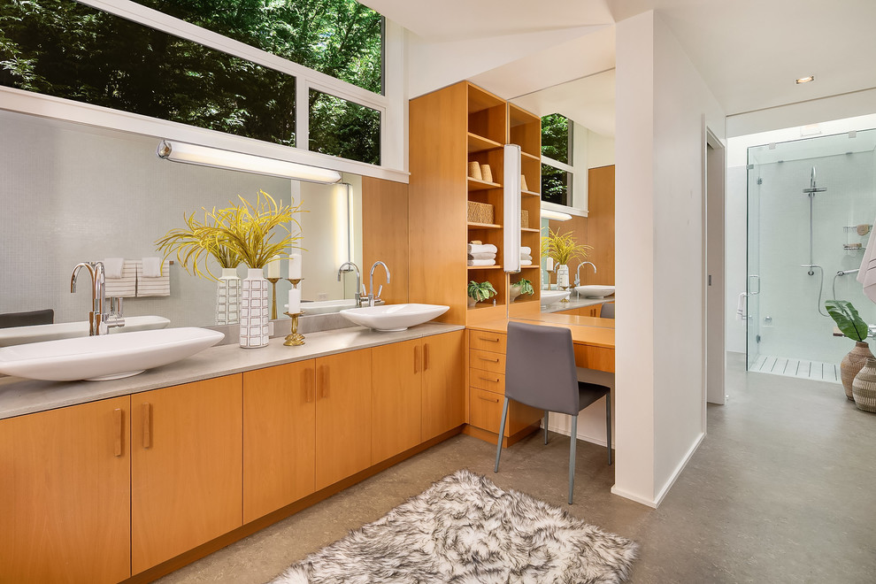 This is an example of an expansive contemporary master bathroom in Seattle with orange cabinets, white walls, a vessel sink, grey floor, a hinged shower door, a curbless shower, grey benchtops and flat-panel cabinets.