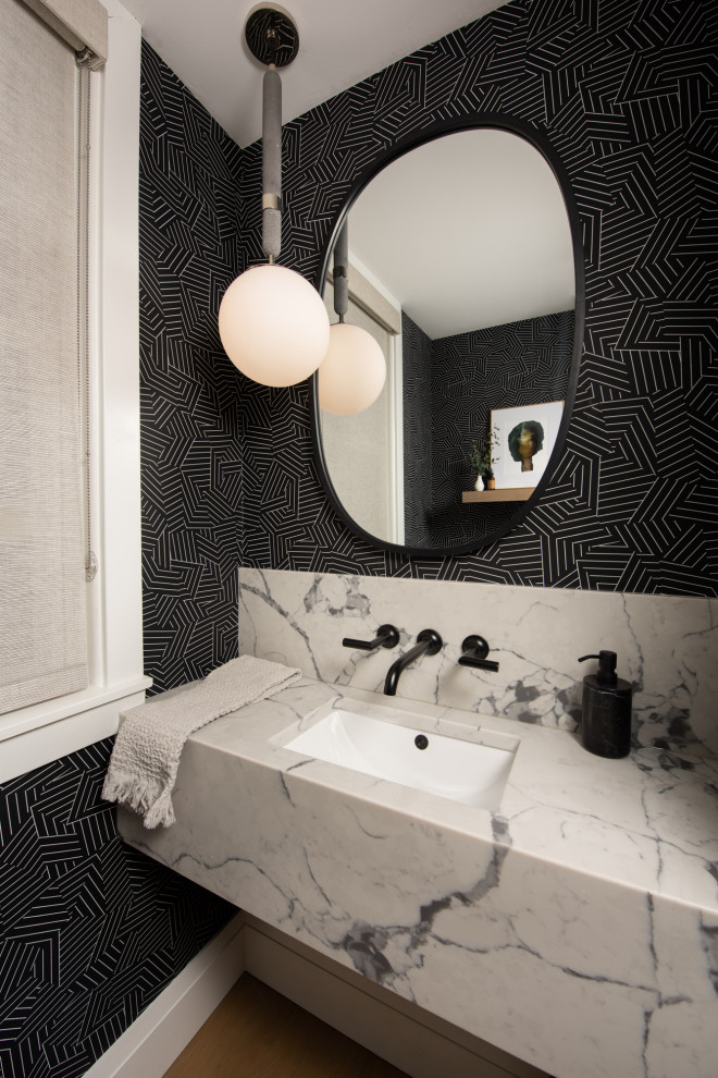 Example of a small transitional wallpaper powder room design in Chicago with open cabinets, white cabinets, a one-piece toilet, black walls, a drop-in sink, quartz countertops, white countertops and a floating vanity