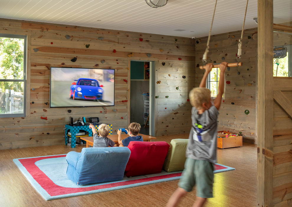 Photo of a mid-sized beach style kids' playroom for kids 4-10 years old and boys in Other with cork floors and brown floor.
