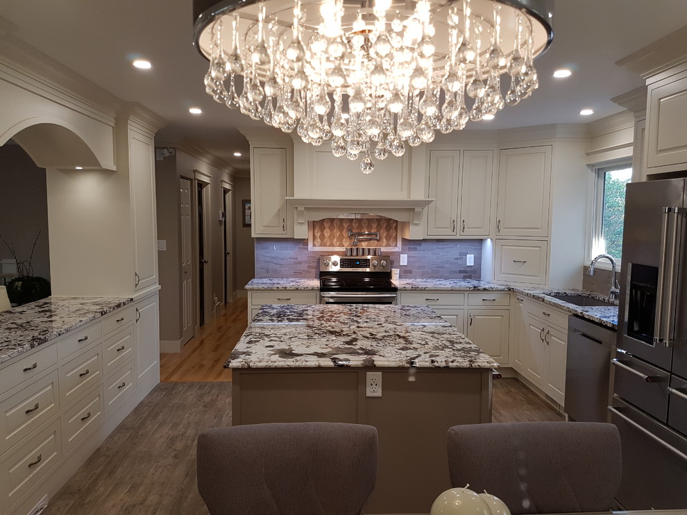 Inspiration for a mid-sized transitional u-shaped vinyl floor and gray floor eat-in kitchen remodel in Calgary with an undermount sink, beaded inset cabinets, white cabinets, granite countertops, gray backsplash, stainless steel appliances, two islands, gray countertops and ceramic backsplash