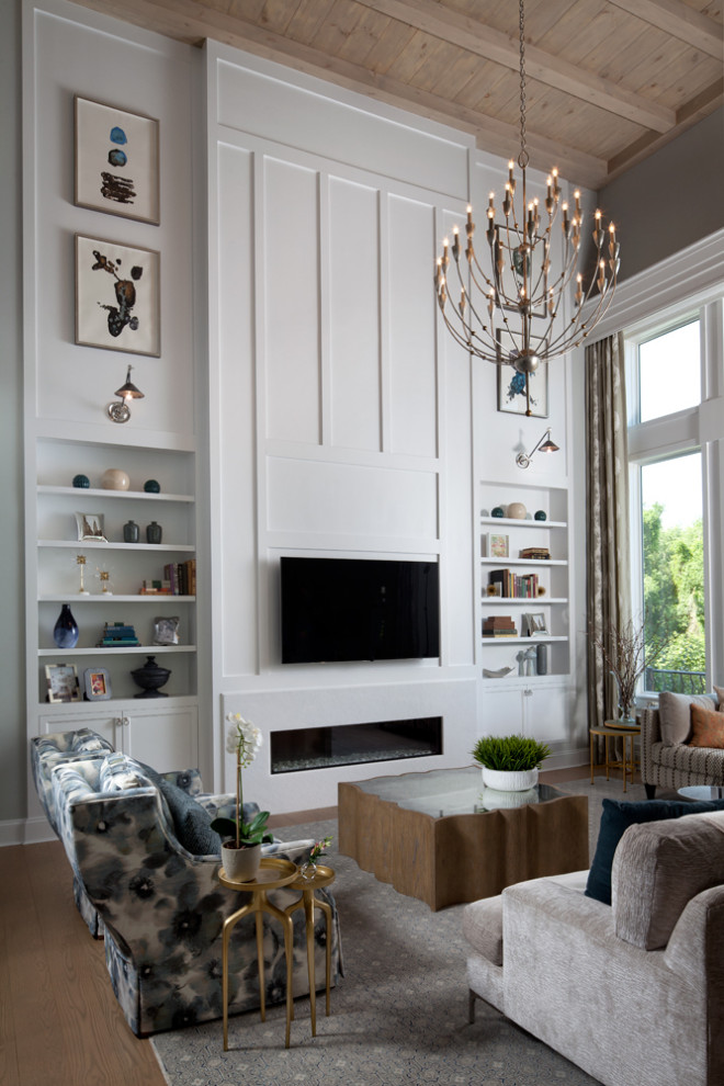 Inspiration for a contemporary open plan games room in Baltimore with white walls, dark hardwood flooring, a ribbon fireplace, a stone fireplace surround, a wall mounted tv, brown floors, exposed beams and wainscoting.
