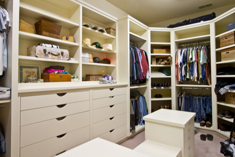 Large arts and crafts gender-neutral dressing room in Dallas with flat-panel cabinets, white cabinets and carpet.
