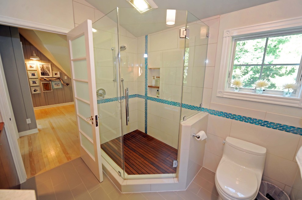 This is an example of a transitional bathroom in Milwaukee with a corner shower.