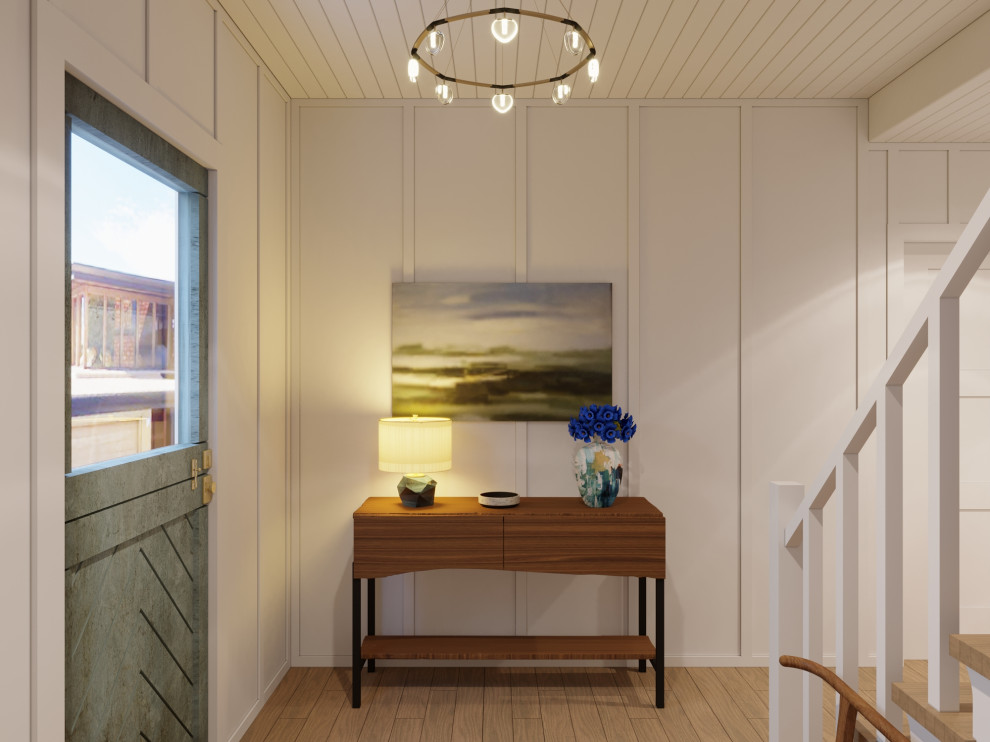 Foto de distribuidor costero de tamaño medio con paredes blancas, suelo de madera clara, puerta tipo holandesa, puerta azul, suelo marrón, machihembrado y panelado