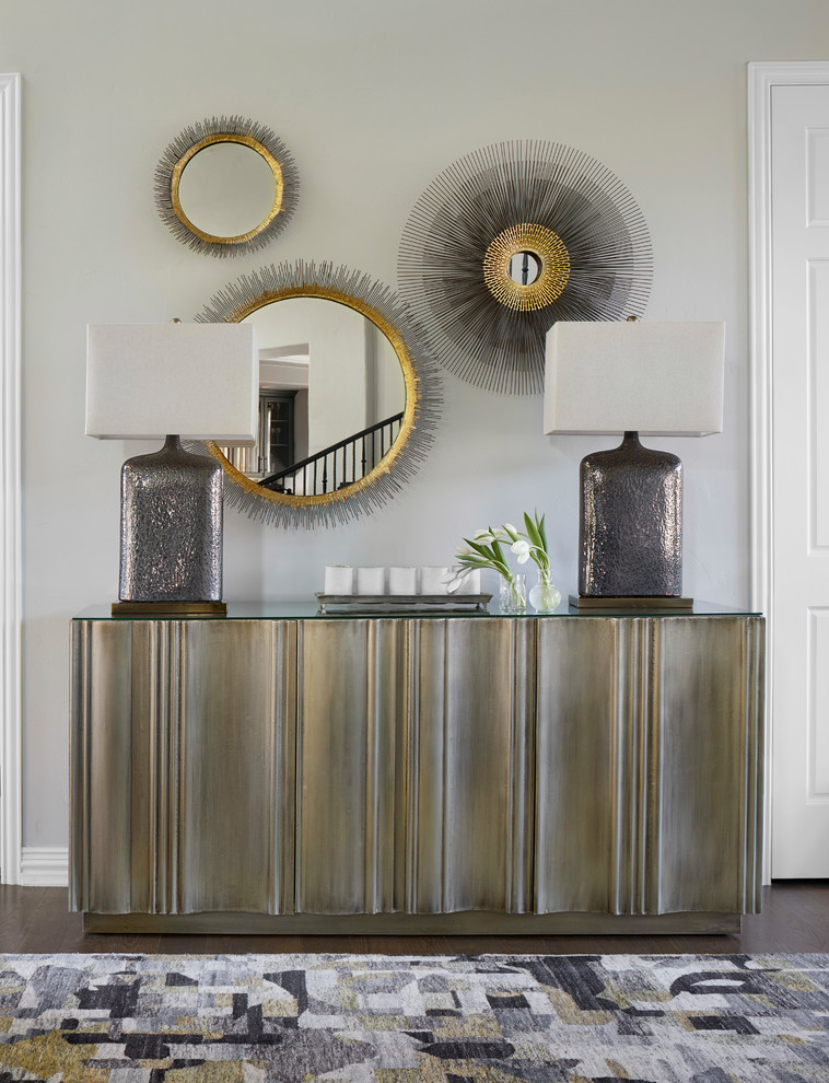 Example of a mid-sized transitional medium tone wood floor and brown floor foyer design in Denver with gray walls
