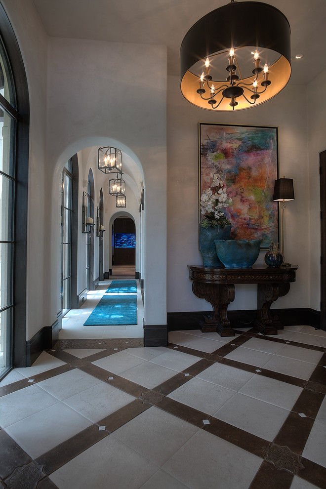 Inspiration for a transitional porcelain tile foyer remodel in Houston with white walls