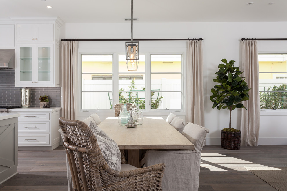 Inspiration for a mid-sized coastal light wood floor kitchen/dining room combo remodel in Orange County with white walls
