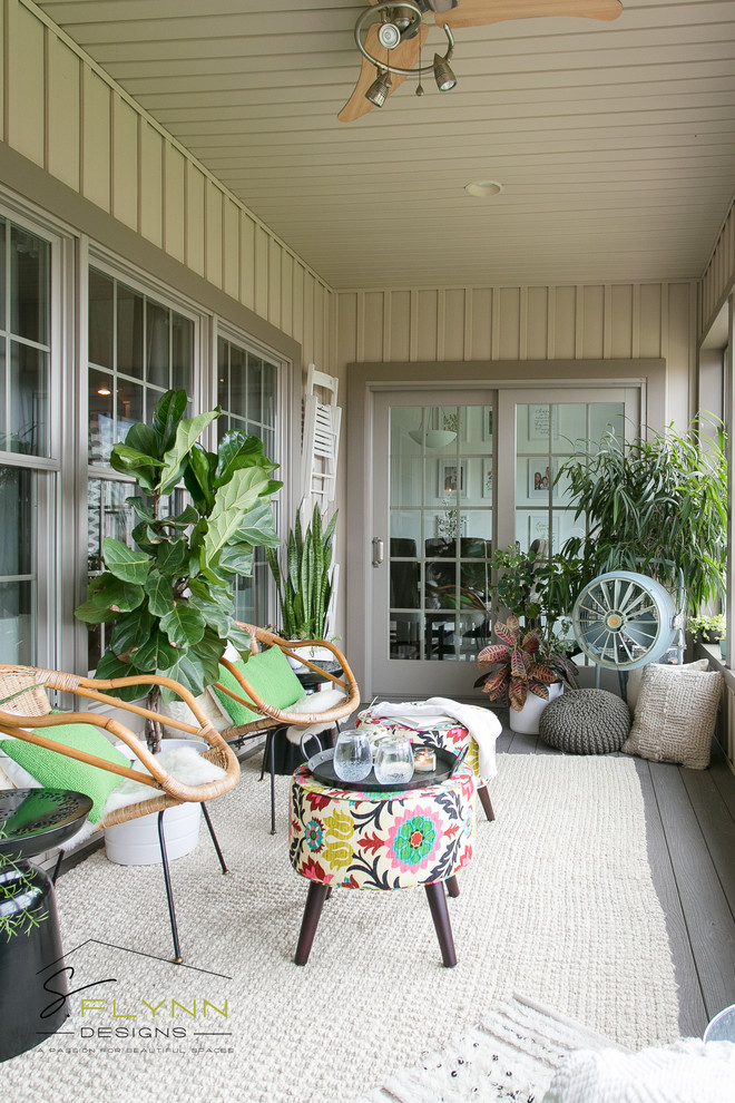 Inspiration for a small beach style sunroom in Cleveland with laminate floors.