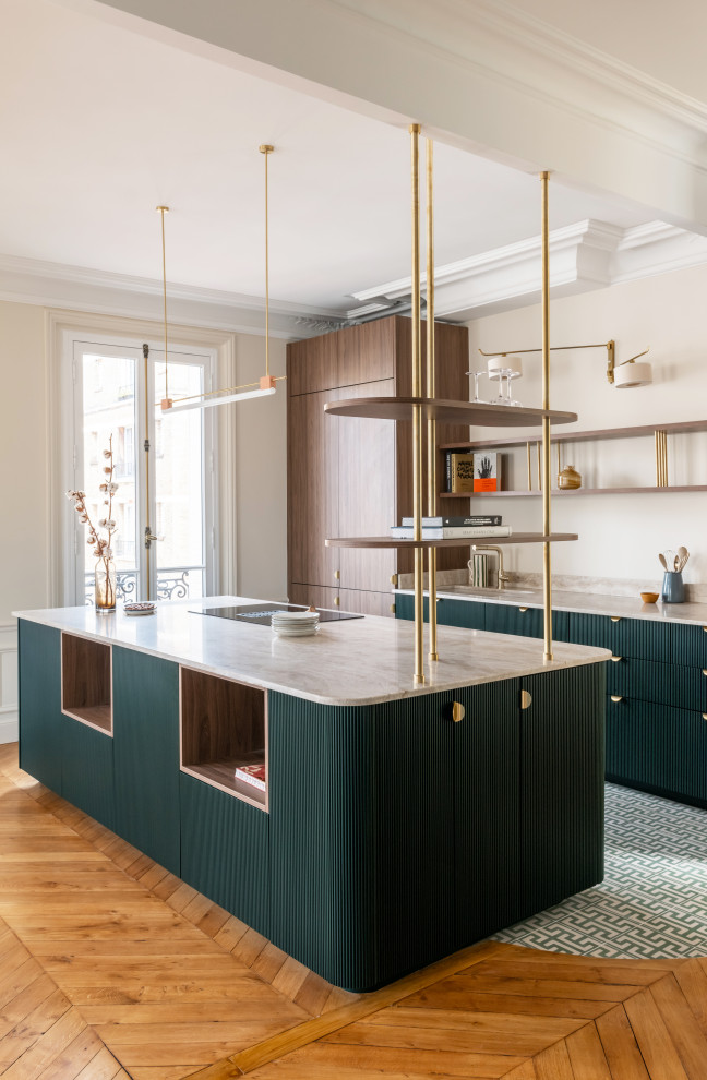 Photo of a large midcentury galley open plan kitchen in Paris with a single-bowl sink, beaded inset cabinets, green cabinets, marble benchtops, beige splashback, marble splashback, panelled appliances, cement tiles, with island, green floor and beige benchtop.