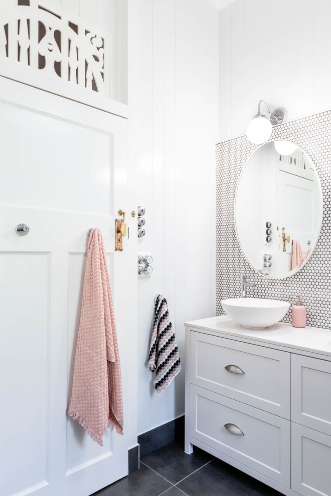This is an example of a mid-sized transitional master bathroom in Brisbane with shaker cabinets, white cabinets, an alcove tub, a shower/bathtub combo, a wall-mount toilet, white tile, mosaic tile, a vessel sink, engineered quartz benchtops, an open shower and white benchtops.