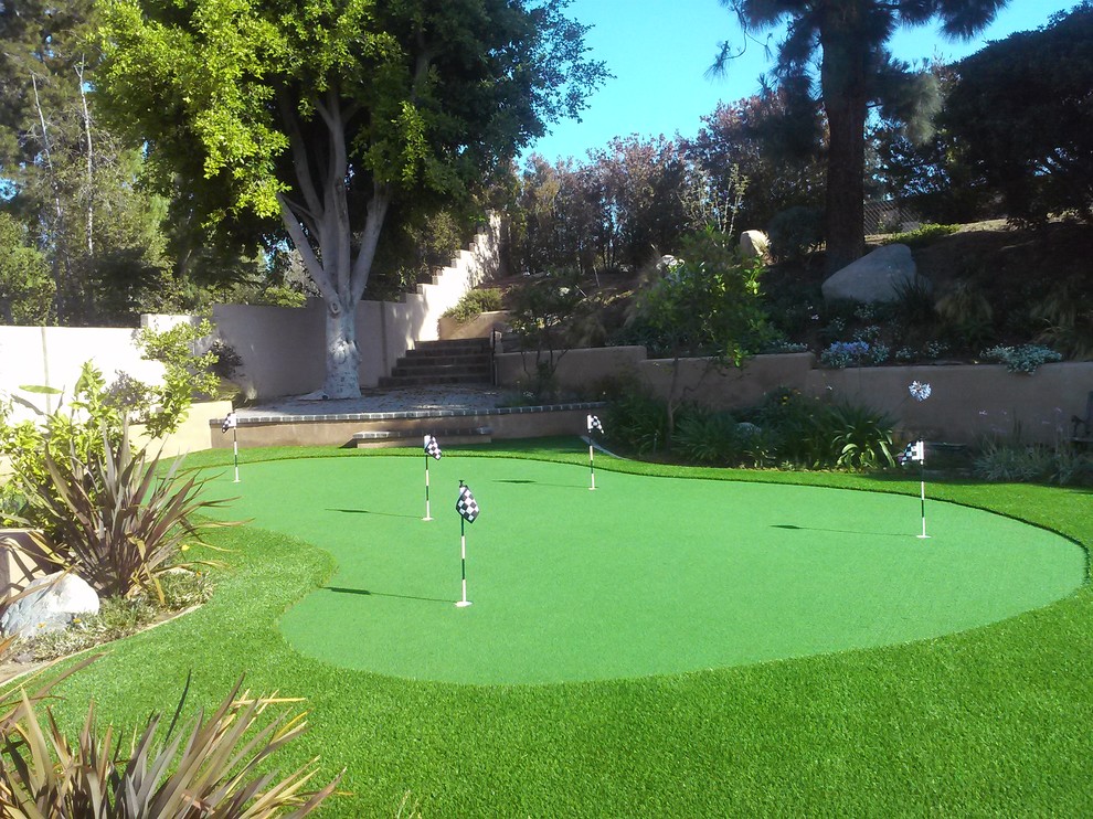 This is an example of a tropical drought-tolerant backyard landscaping in Orange County.