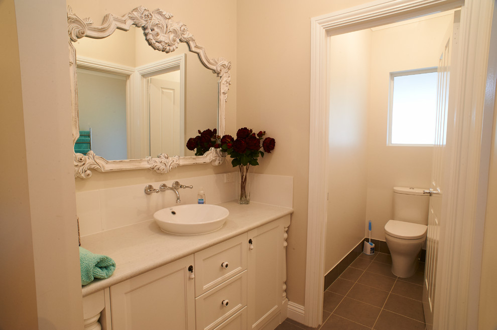 Traditional powder room in Other.