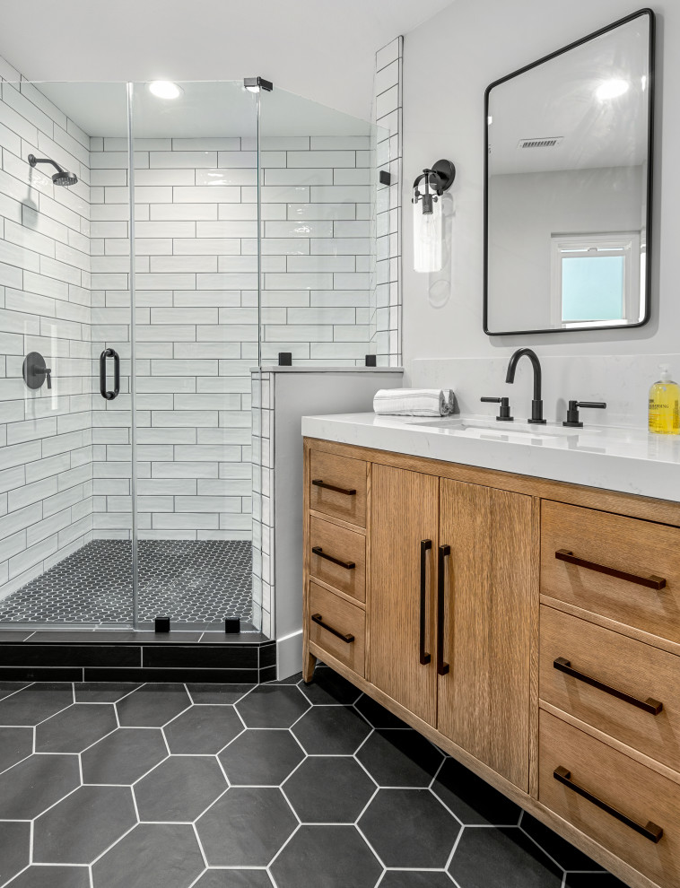 Inspiration for a mid-sized country 3/4 bathroom in Orange County with flat-panel cabinets, light wood cabinets, white tile, ceramic tile, porcelain floors, an undermount sink, engineered quartz benchtops, black floor, white benchtops, a single vanity and a freestanding vanity.