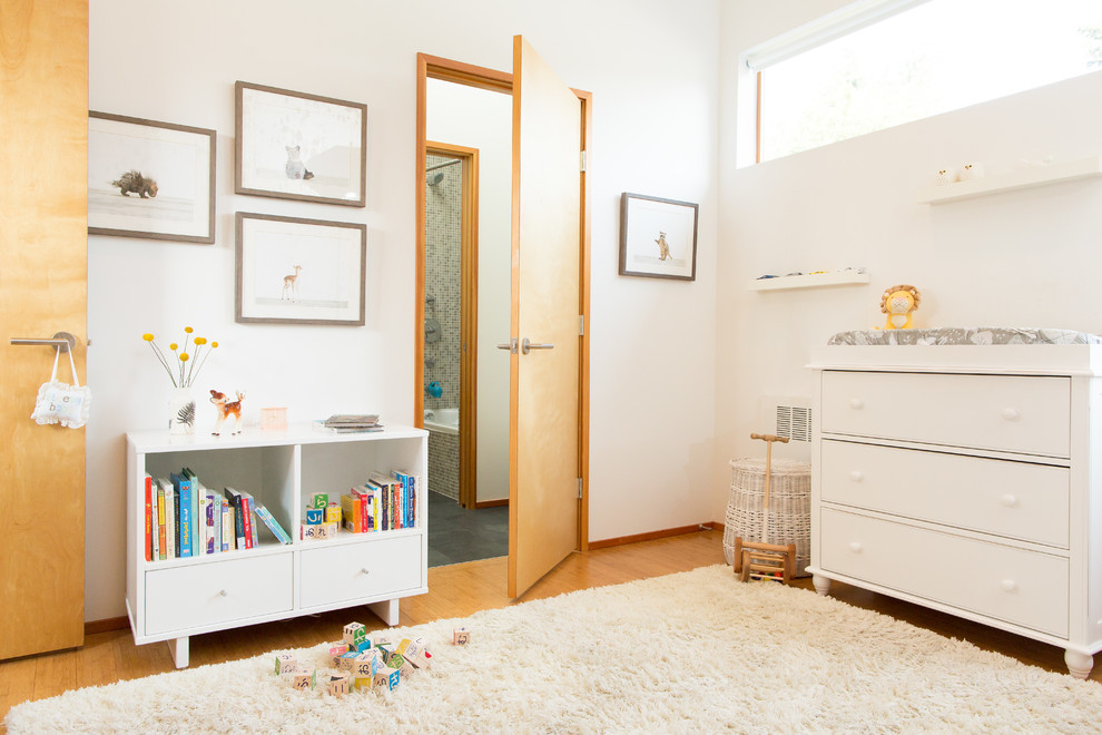 Small danish gender-neutral beige floor nursery photo in Seattle with white walls