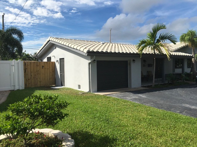 Small transitional attached one-car garage photo