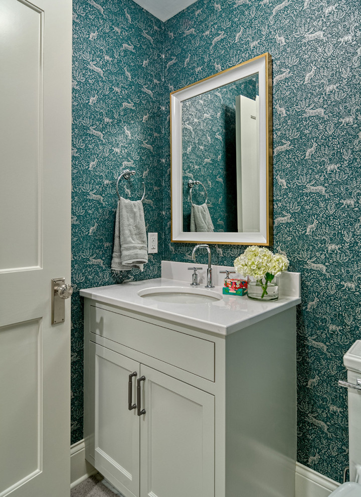 Design ideas for a small classic bathroom in Minneapolis with flat-panel cabinets, white cabinets, a one-piece toilet, green walls, laminate floors, a submerged sink, granite worktops, beige floors, white worktops, a single sink, a freestanding vanity unit and wallpapered walls.