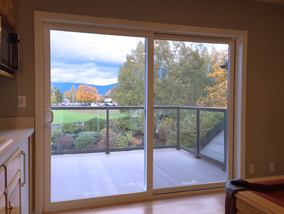 Inspiration for a small transitional enclosed vinyl floor balcony remodel with gray walls, no fireplace and no tv