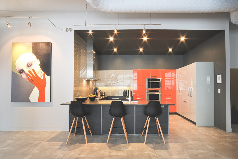 Photo of a mid-sized contemporary u-shaped eat-in kitchen in Montreal with an undermount sink, flat-panel cabinets, orange cabinets, quartz benchtops, beige splashback, glass tile splashback, panelled appliances, ceramic floors and a peninsula.