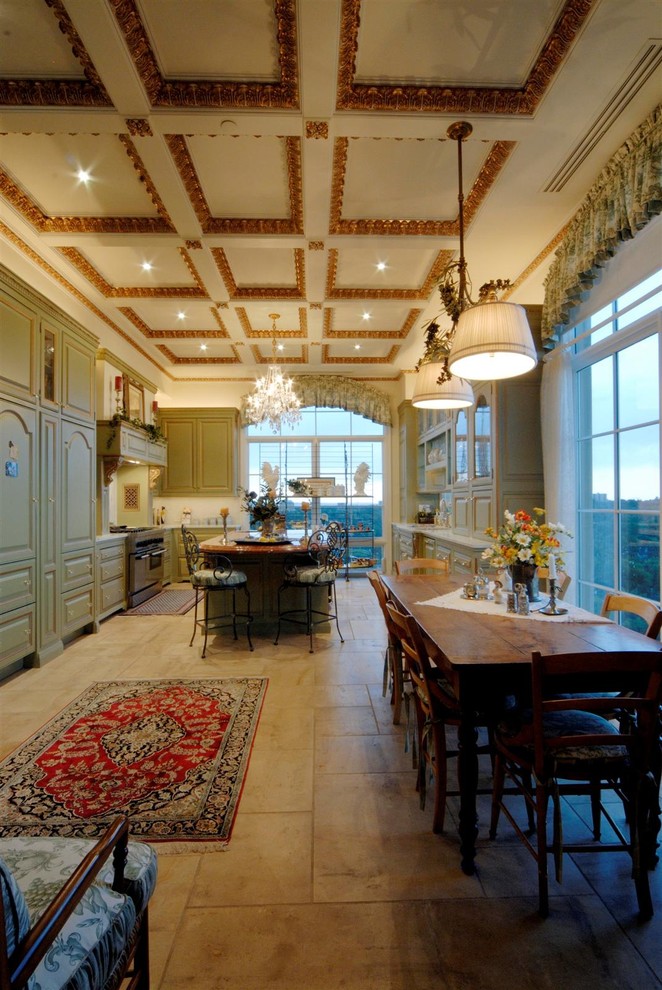 Photo of a large traditional galley eat-in kitchen in Los Angeles with a double-bowl sink, raised-panel cabinets, light wood cabinets, marble benchtops, stainless steel appliances, ceramic floors and with island.