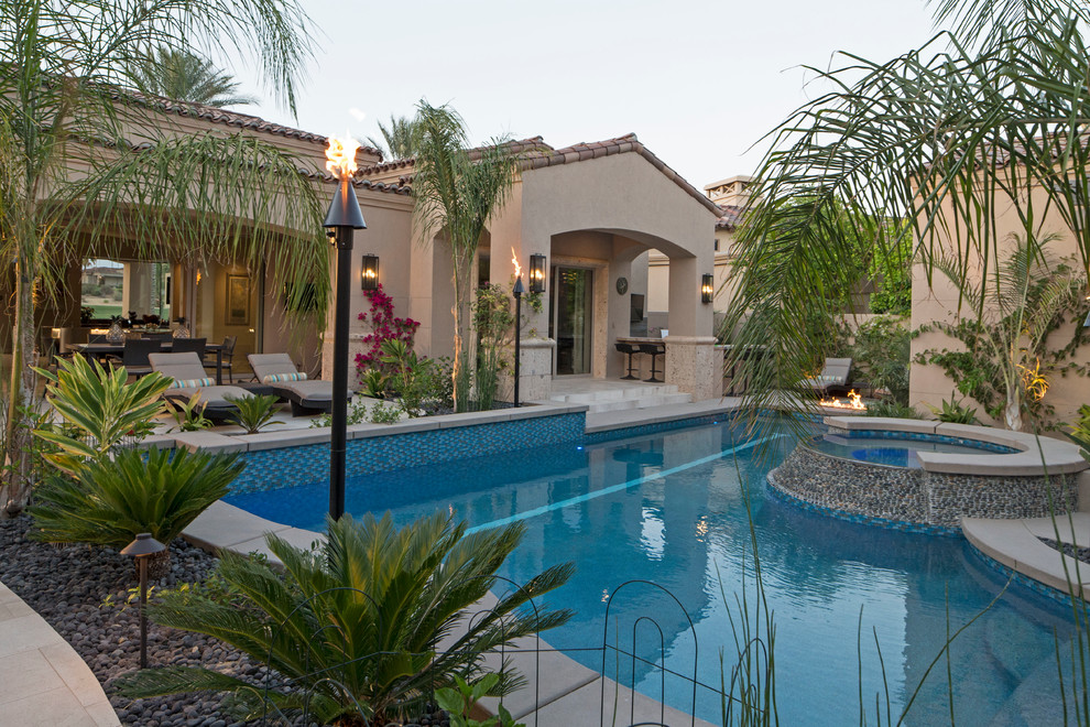 Mid-sized island style custom-shaped natural hot tub photo