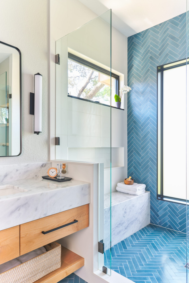 Inspiration for a medium sized contemporary ensuite bathroom in Austin with flat-panel cabinets, light wood cabinets, blue tiles, white walls, a submerged sink, marble worktops, blue floors, a shower bench, double sinks and a floating vanity unit.
