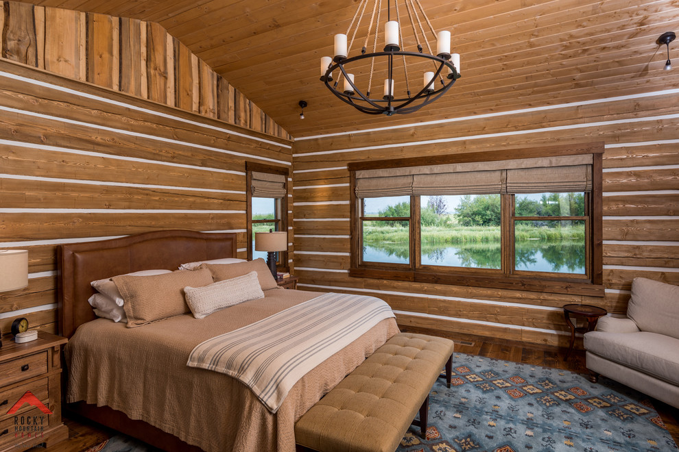 Bedroom - mid-sized rustic master medium tone wood floor and brown floor bedroom idea with brown walls