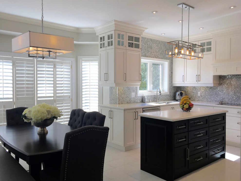 Mid-sized transitional u-shaped separate kitchen in Toronto with a double-bowl sink, recessed-panel cabinets, white cabinets, quartz benchtops, grey splashback, mosaic tile splashback, stainless steel appliances, porcelain floors and with island.