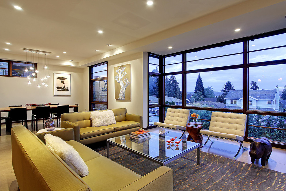 This is an example of a contemporary living room in Seattle with beige walls.