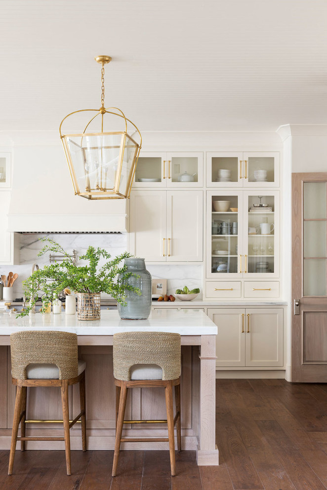 Design ideas for a large beach style l-shaped eat-in kitchen in Salt Lake City with white cabinets, marble benchtops, multi-coloured splashback, marble splashback, medium hardwood floors, with island and multi-coloured benchtop.