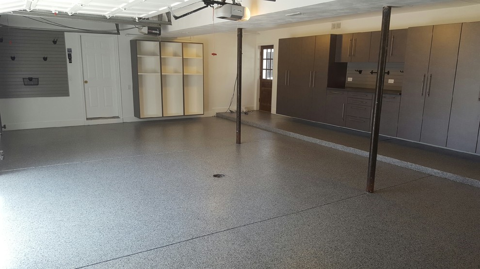 Garage - large transitional attached four-car garage idea