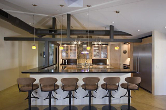 Home design - transitional l-shaped medium tone wood floor home design idea in Phoenix with raised-panel cabinets, medium tone wood cabinets, wood countertops, multicolored backsplash, ceramic backsplash and an island