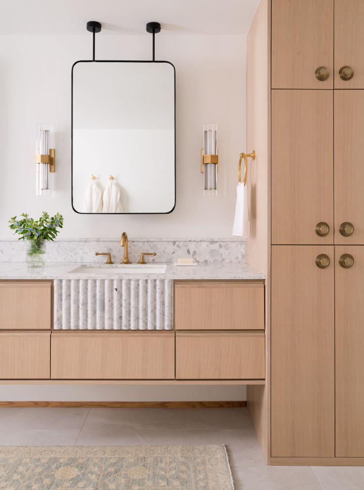 Transitional bathroom photo in Austin with flat-panel cabinets, medium tone wood cabinets, an undermount sink and a floating vanity