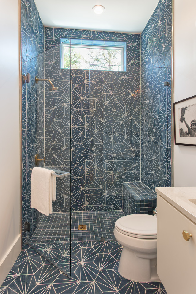 Photo of a contemporary 3/4 bathroom in Austin with flat-panel cabinets, beige cabinets, an alcove shower and blue tile.