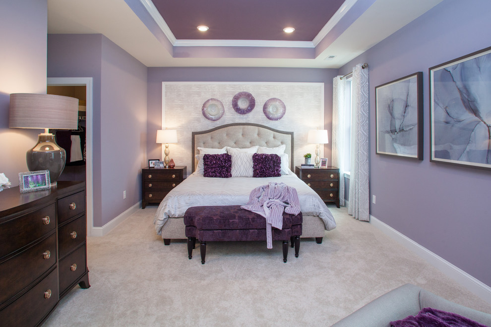 Large transitional master bedroom in Philadelphia with purple walls, carpet and grey floor.