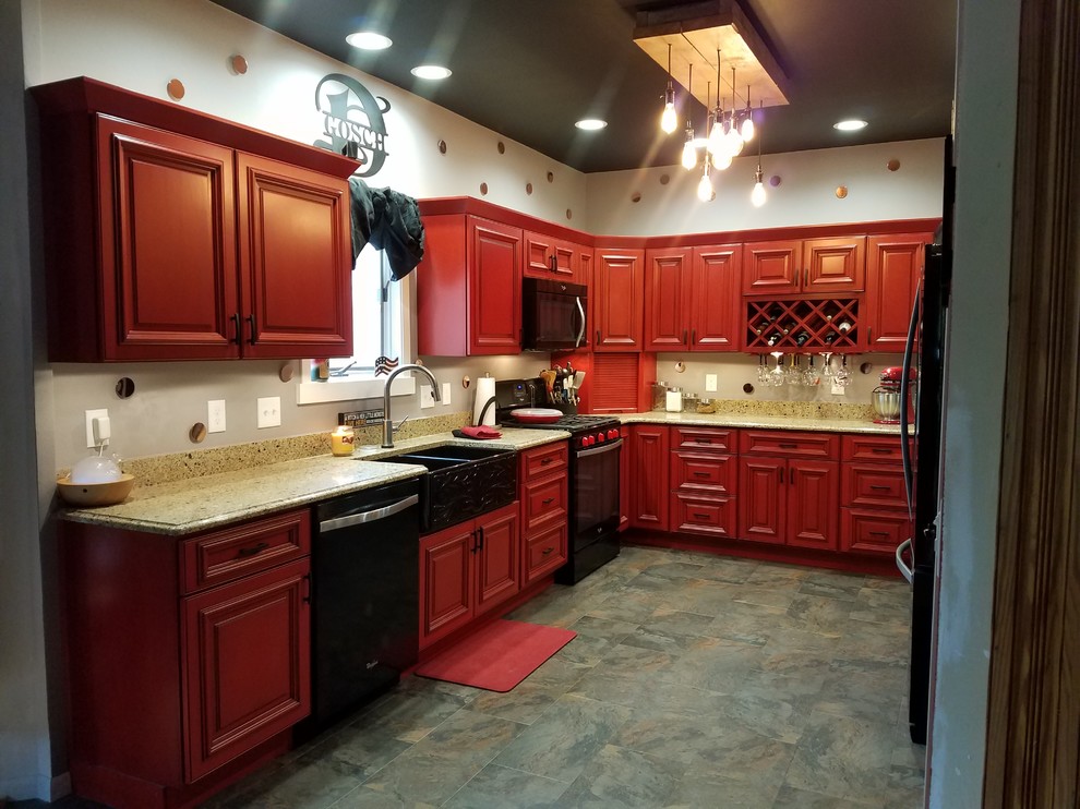 Inspiration for a l-shaped slate floor and multicolored floor enclosed kitchen remodel in Cedar Rapids with a double-bowl sink, beaded inset cabinets, red cabinets, black appliances, no island and brown countertops