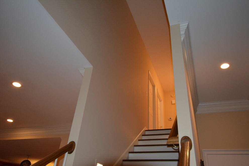Inspiration for a small modern wood straight staircase in Atlanta with wood risers.