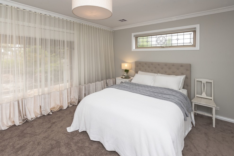 Photo of a transitional bedroom in Toronto.