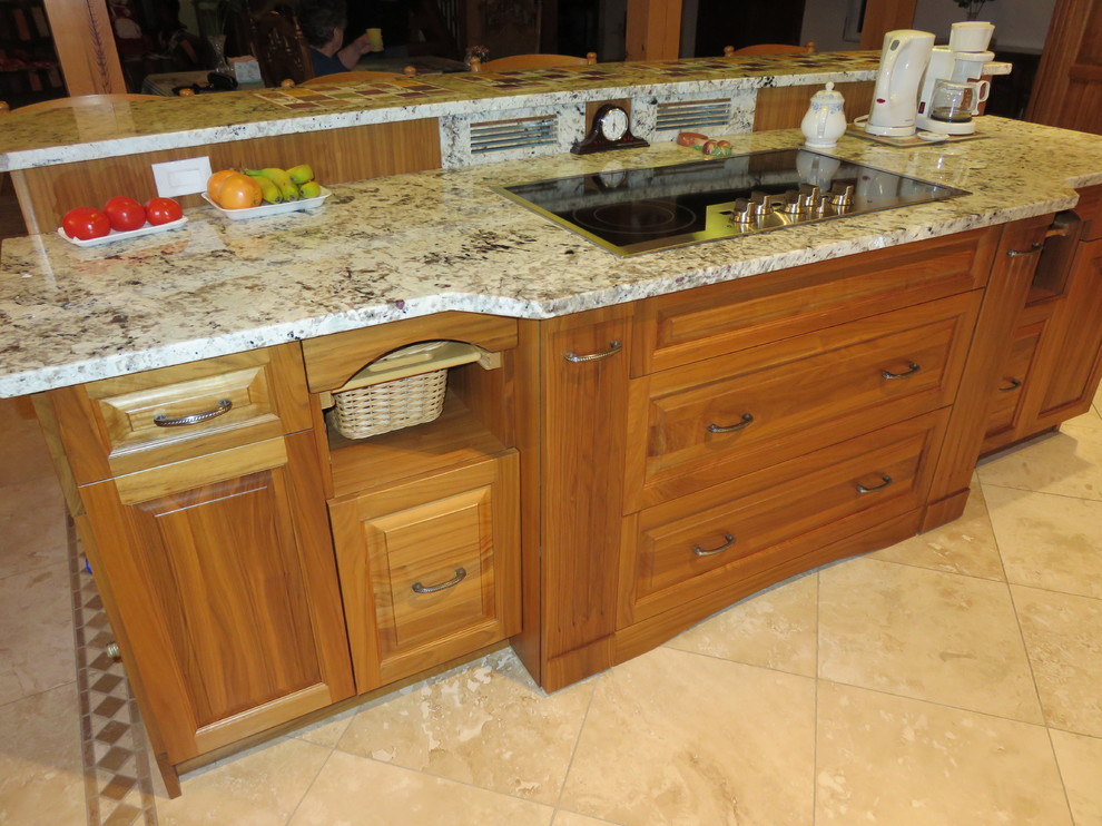 Large transitional l-shaped ceramic tile open concept kitchen photo with raised-panel cabinets, medium tone wood cabinets, granite countertops, stainless steel appliances, an island, white backsplash, subway tile backsplash and a double-bowl sink