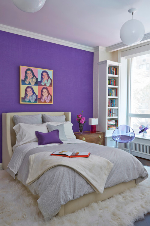 Design ideas for a mid-sized transitional kids' bedroom for kids 4-10 years old and girls in New York with purple walls and dark hardwood floors.