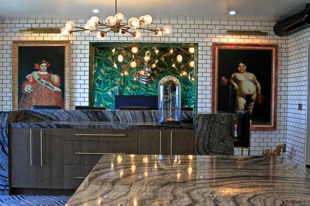 Enclosed kitchen - huge eclectic l-shaped ceramic tile enclosed kitchen idea in Orange County with an undermount sink, flat-panel cabinets, gray cabinets, marble countertops, white backsplash, subway tile backsplash, black appliances and an island