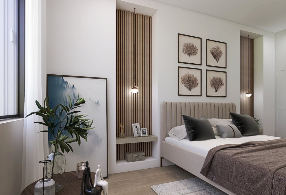 This is an example of a mid-sized contemporary master bedroom in Reims with beige walls, light hardwood floors, beige floor and planked wall panelling.