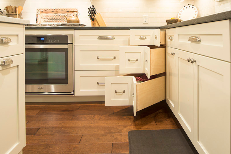 Inspiration for a transitional eat-in kitchen remodel in Austin with shaker cabinets and white cabinets