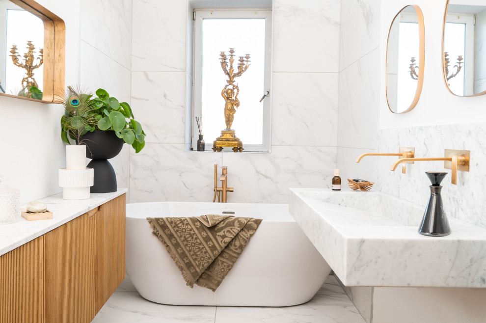 This is an example of a small contemporary 3/4 bathroom in Toulouse with a drop-in tub, white tile, marble, a trough sink, marble benchtops, white benchtops, a single vanity and a floating vanity.