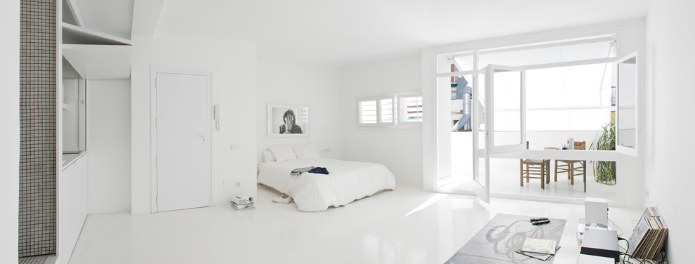 Inspiration for a mid-sized contemporary master bedroom in Barcelona with white walls and no fireplace.
